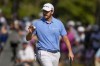 Patrick Cantlay waves after making a putt on the seventh hole during the third round of the U.S. Open golf tournament Saturday, June 15, 2024, in Pinehurst, N.C. (AP Photo/Matt York)