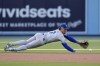 Kansas City Royals shortstop Bobby Witt Jr. can't get to a ball hit for a single by Los Angeles Dodgers' Mookie Betts during the first inning of a baseball game Saturday, June 15, 2024, in Los Angeles. (AP Photo/Mark J. Terrill)