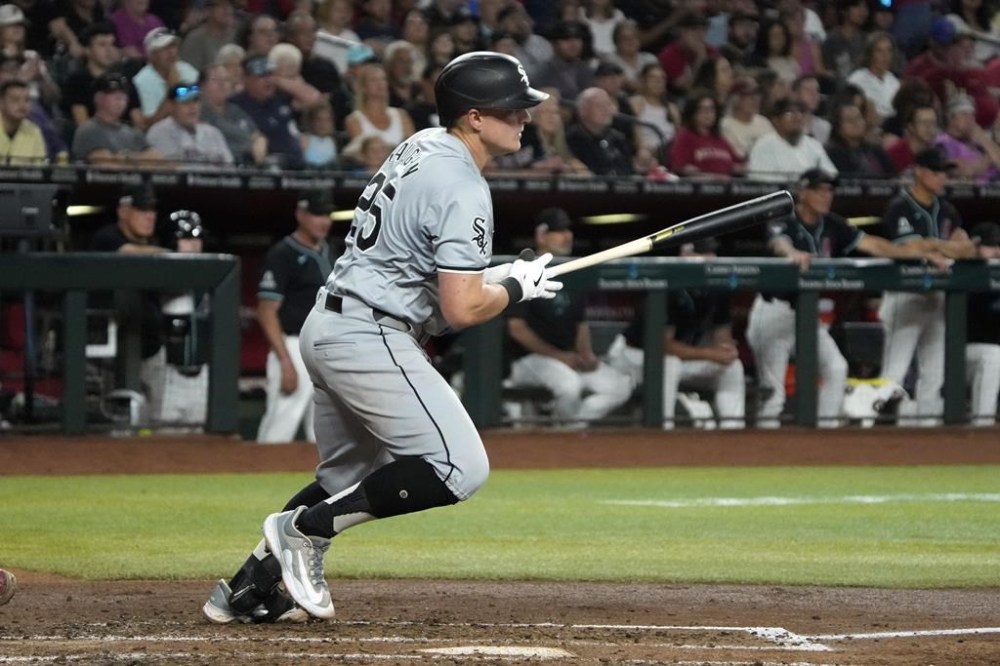 Chicago White Sox' Andrew Vaughn watches his single against the Arizona Diamondbacks during the third inning of a baseball game Saturday, June 15, 2024, in Phoenix. (AP Photo/Rick Scuteri)