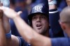 Tampa Bay Rays' Ben Rortvedt celebrates with teammates after hitting a grand slam during the fourth inning of a baseball game against the Atlanta Braves, Sunday, June 16, 2024, in Atlanta. (AP Photo/Butch Dill)