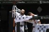 Baltimore Orioles' Colton Cowser, left, drinks from the 