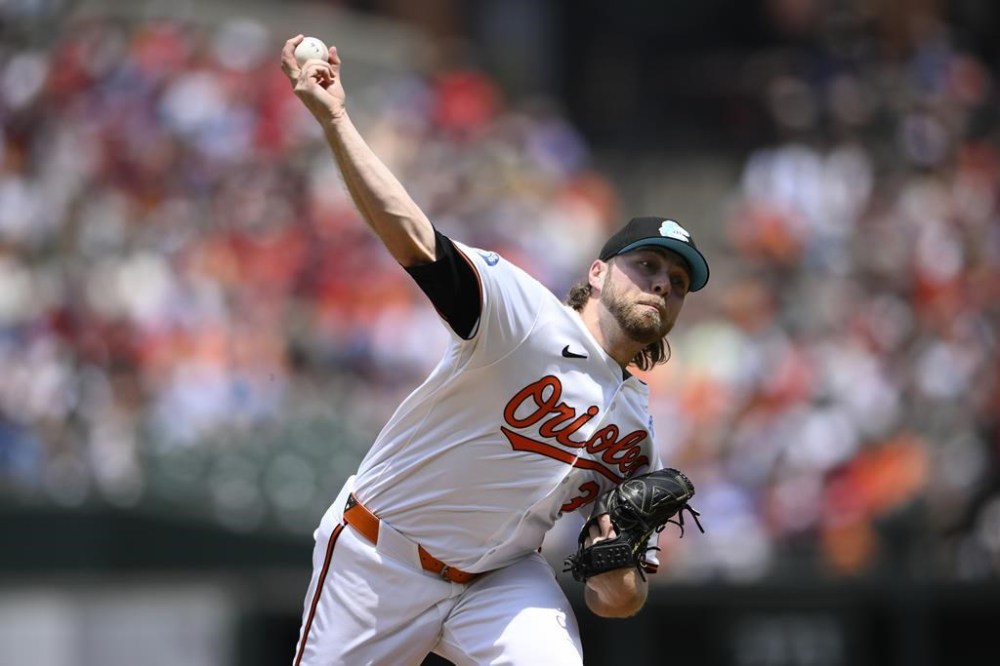 Baltimore Orioles starting pitcher Corbin Burnes throws during the first inning of a baseball game against the Philadelphia Phillies, Sunday, June 16, 2024, in Baltimore. (AP Photo/Nick Wass)