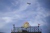 A fighter jet, as part of Maryland Fleet Week and Flyover festivities, flies by Oriole Park at Camden Yards during a baseball game between the Baltimore Orioles and the Philadelphia Phillies, Sunday, June 16, 2024, in Baltimore. (AP Photo/Nick Wass)