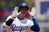 Los Angeles Dodgers' Shohei Ohtani gestures toward his dugout as he rounds third after hitting a solo home run during the third inning of a baseball game against the Kansas City Royals Sunday, June 16, 2024, in Los Angeles. (AP Photo/Mark J. Terrill)