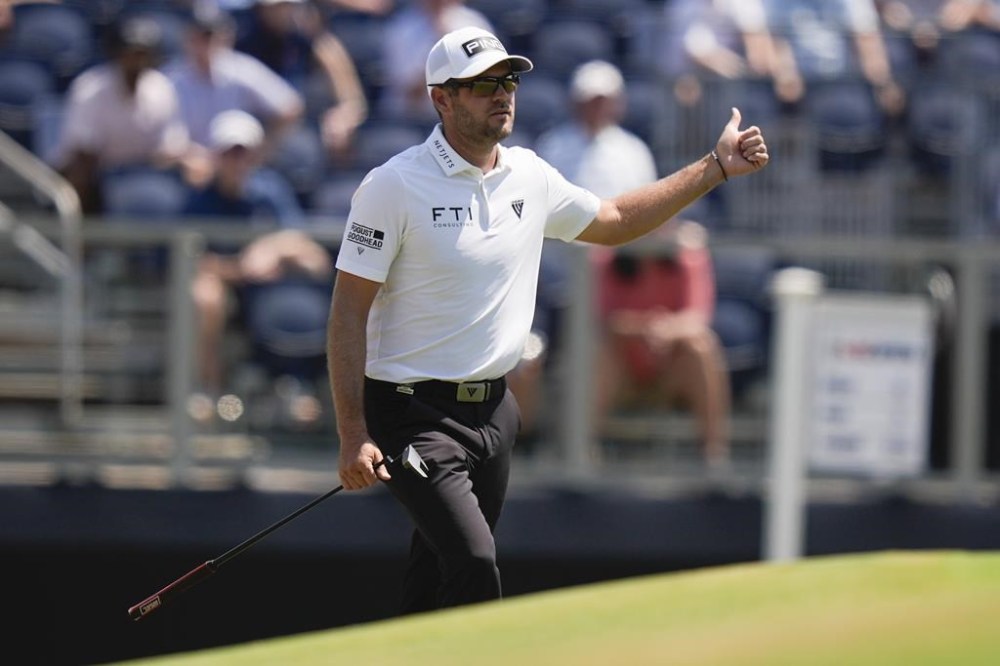 Corey Conners, of Canada, gestures on the third hole during the third round of the U.S. Open golf tournament Saturday, June 15, 2024, in Pinehurst, N.C. (AP Photo/Frank Franklin II)