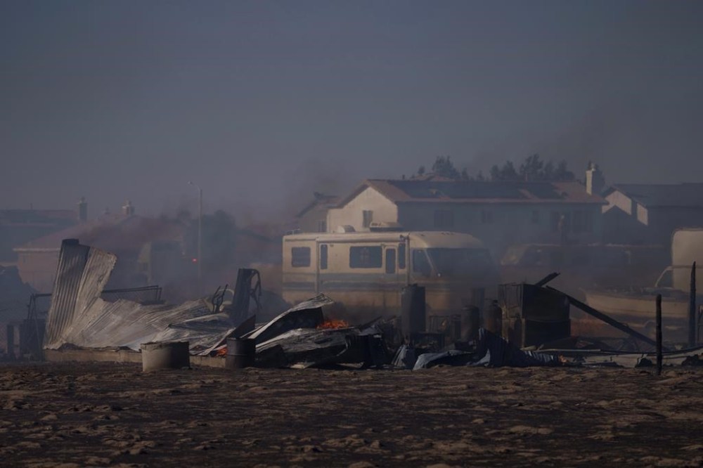 A building lies destroyed from the Max Fire on Sunday, June 16, 2024, in Lancaster, Calif. (AP Photo/Eric Thayer)