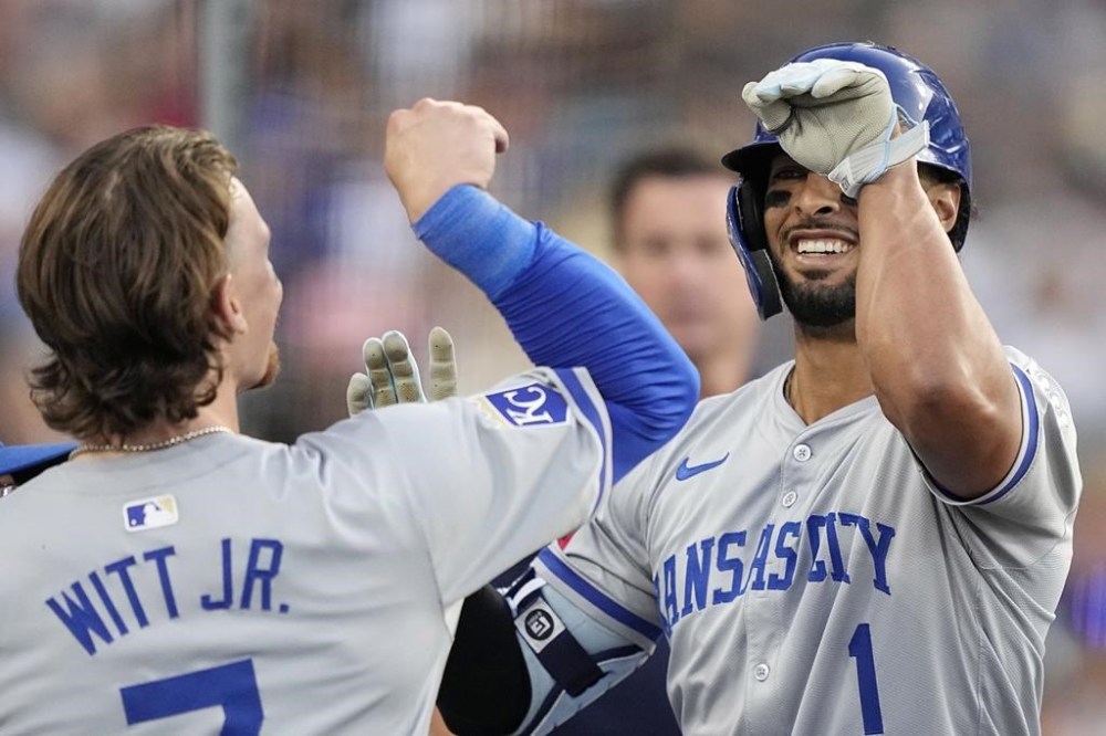 Kansas City Royals' MJ Melendez, right, celebrates with Bobby Witt Jr. after hitting a grand slam during the sixth inning of a baseball game against the Los Angeles Dodgers Saturday, June 15, 2024, in Los Angeles. (AP Photo/Mark J. Terrill)