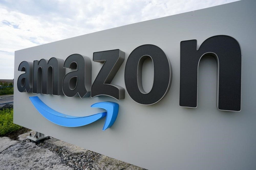 Canadians can now return their Amazon orders through Staples. The e-commerce giant says 298 of the office supply retailer's stores are now equipped to handle Amazon returns.Amazon signage is shown in Ottawa on Monday, July 11, 2022. THE CANADIAN PRESS/Sean Kilpatrick