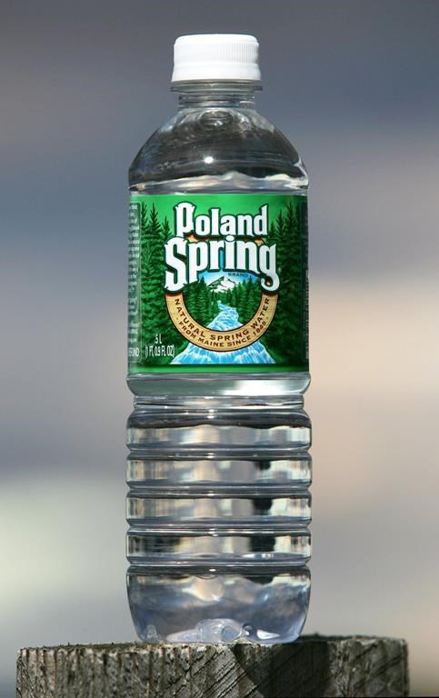 Primo Water Corp. has signed a deal to merge with of BlueTriton Brands Inc., the company behind spring water brands including Poland Spring, Deer Park and Ozarka. A bottle of Poland Spring water is seen Thursday, Nov. 10, 2005, in Fryeburg, Maine. THE CANADIAN PRESS/AP-Robert F. Bukaty