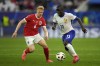 N'Golo Kante of France, right, challenges for the ball with Austria's Nicolas Seiwald during a Group D match between Austria and France at the Euro 2024 soccer tournament in Duesseldorf, Germany, Monday, June 17, 2024. (AP Photo/Alessandra Tarantino)