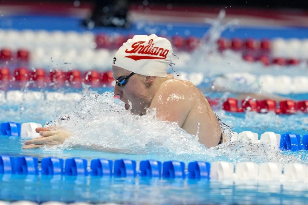 Lilly King swims during the Women's 100 breaststroke finals Monday, June 17, 2024, at the US Swimming Olympic Trials in Indianapolis. (AP Photo/Darron Cummings)