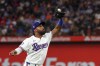 Texas Rangers third baseman Ezequiel Duran catches a fly ball by New York Mets' DJ Stewart in the first inning of a baseball game, Monday, June 17, 2024, in Arlington, Texas. (AP Photo/Richard W. Rodriguez)