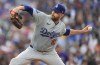 Los Angeles Dodgers starting pitcher James Paxton works against the Colorado Rockies in the fifth inning of a baseball game Monday, June 17, 2024, in Denver. (AP Photo/David Zalubowski)
