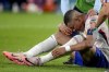 Kylian Mbappe of France receives a treatment after suffering an injury during a Group D match between Austria and France at the Euro 2024 soccer tournament in Duesseldorf, Germany, Monday, June 17, 2024. (AP Photo/Alessandra Tarantino)