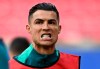Portugal's Cristiano Ronaldo grimaces during a training session of the national soccer team of Portugal in Leipzig, Germany, Monday, June 17, 2024. (Hendrik Schmidt/dpa via AP)