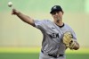 New York Yankees starting pitcher Cody Poteet throws during the first inning of a baseball game against the Kansas City Royals Wednesday, June 12, 2024, in Kansas City, Mo. (AP Photo/Charlie Riedel)