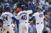 Chicago Cubs' Ian Happ right, celebrates with teammates Mike Tauchman (40) and Cody Bellinger (24) after hitting a three-run home run during the seventh inning of a baseball game against the St. Louis Cardinals, Saturday, June 15, 2024, in Chicago. (AP Photo/Paul Beaty)