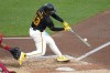 Pittsburgh Pirates' Ke'Bryan Hayes hits a solo home run off Cincinnati Reds starting pitcher Nick Lodolo during the seventh inning of a baseball game in Pittsburgh, Tuesday, June 18, 2024. (AP Photo/Gene J. Puskar)