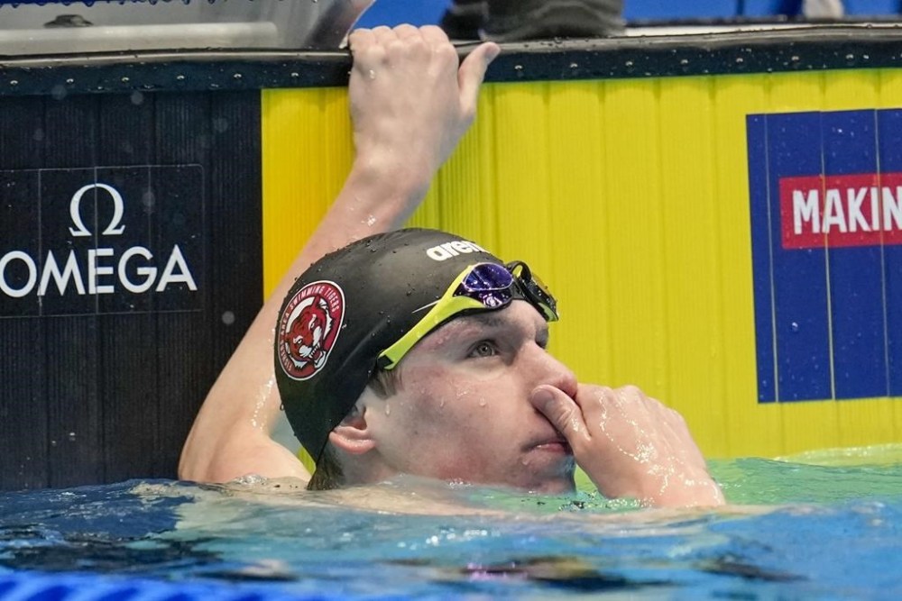 Luke Whitlock looks at his time during the Men's 400 freestyle preliminaries Saturday, June 15, 2024, at the US Swimming Olympic Trials in Indianapolis. (AP Photo/Michael Conroy)