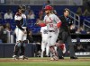 St. Louis Cardinals' Brendan Donovan scores on a home run against the Miami Marlins during the second inning of a baseball game Tuesday, June 18, 2024, in Miami. (AP Photo/Michael Laughlin)