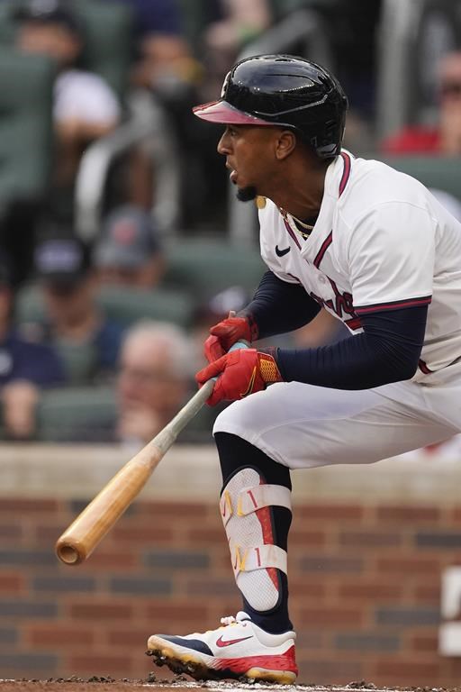 Atlanta Braves' Ozzie Albies drives in a run with a triple in the first inning of a baseball game against the Detroit Tigers Tuesday, June 18, 2024, in Atlanta. (AP Photo/John Bazemore)