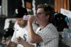 Chicago White Sox starting pitcher Jonathan Cannon takes a drink while meeting with pitching coach Ethan Katz in the dugout during the seventh inning of the team's baseball game against the Houston Astros on Tuesday, June 18, 2024, in Chicago. (AP Photo/Charles Rex Arbogast)