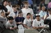 Fans attempt to get autographs from New York Yankees' Ben Rice at the dugout after the team's baseball game against the Baltimore Orioles, Tuesday, June 18, 2024, in New York. (AP Photo/Pamela Smith)