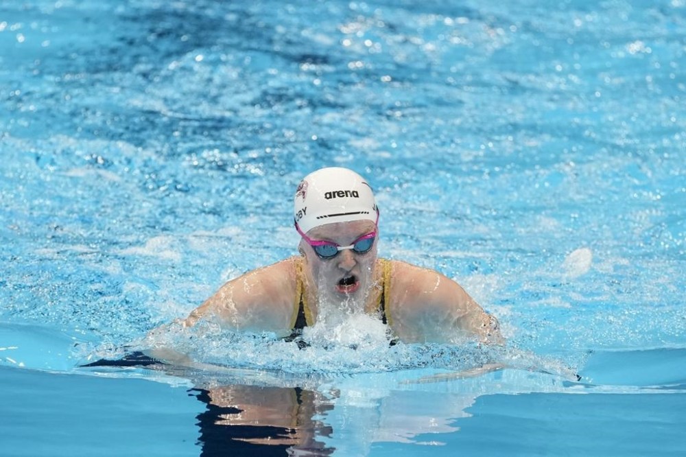 Lydia Jacoby swims during the Women's 100 breaststroke preliminary heat Sunday, June 16, 2024, at the US Swimming Olympic Trials in Indianapolis. (AP Photo/Darron Cummings)