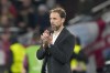 England's manager Gareth Southgate applauds during a Group C match between Serbia and England at the Euro 2024 soccer tournament in Gelsenkirchen, Germany, Sunday, June 16, 2024. (AP Photo/Martin Meissner)