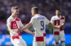 Croatia's Andrej Kramaric, right, celebrates with teammate Luka Sucic after scoring their side's first goal during a Group B match between Croatia and Albania at the Euro 2024 soccer tournament in Hamburg, Germany, Wednesday, June 19, 2024. (AP Photo/Ebrahim Noroozi)