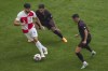Croatia's Josko Gvardiol, left, challenges for the ball with Albania's Jasir Asani, right, and Albania's Elseid Hysaj during a Group B match between Croatia and Albania at the Euro 2024 soccer tournament in Hamburg, Germany, Wednesday, June 19, 2024. (AP Photo/Sunday Alamba)
