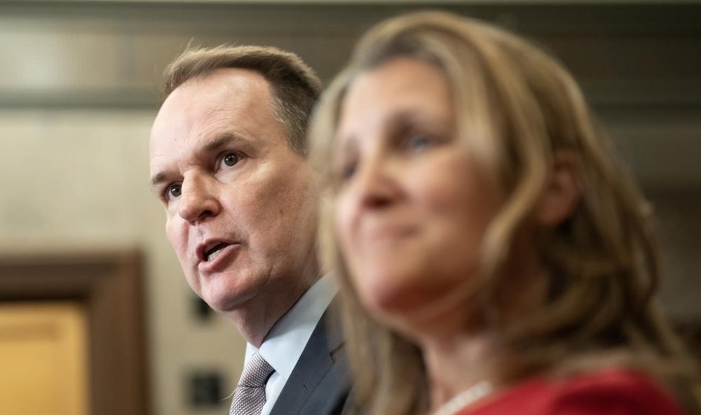 Steve MacKinnon, Leader of the Government in the House of Commons responds to a question as he stands with Deputy Prime Minister and Minister of Finance Chrystia Freeland in the Foyer of the House of Commons, in Ottawa, Wednesday, June 19, 2024. THE CANADIAN PRESS/Adrian Wyld