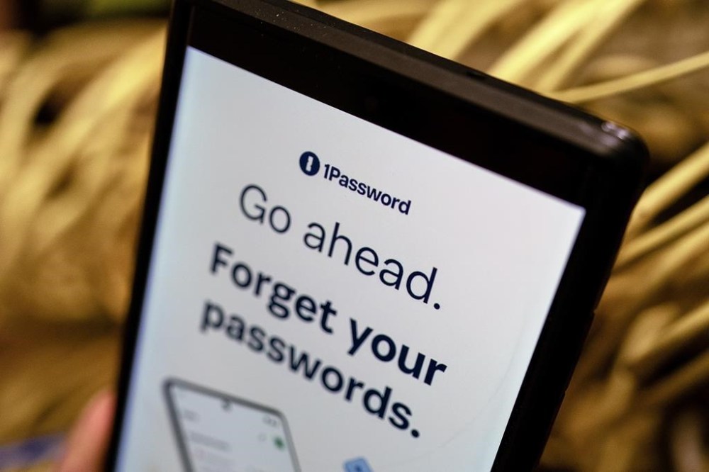 An app screenshot for 1Password is seen on a smartphone in a photo illustration made in Toronto, Monday, June 17, 2024. 1Password is a Toronto-based password management company that actor Ryan Reynolds has invested in. THE CANADIAN PRESS/Giordano Ciampini