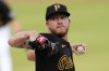 Pittsburgh Pirates starting pitcher Bailey Falter delivers during the second inning of the team's baseball game against the Cincinnati Reds in Pittsburgh, Tuesday, June 18, 2024. (AP Photo/Gene J. Puskar)