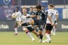 Minnesota United forward Jeong Sang-Bin (11) handles the ball next to FC Dallas midfielder Asier Illarramendi (14) and forward Paul Arriola (7) during the first half of an MLS soccer match Wednesday, June 19, 2024, in Frisco, Texas. (Elías Valverde II/The Dallas Morning News via AP)