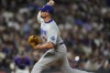 Los Angeles Dodgers relief pitcher Blake Treinen works against the Colorado Rockies in the eighth inning of a baseball game Wednesday, June 19, 2024, in Denver. (AP Photo/David Zalubowski)