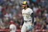 Milwaukee Brewers starting pitcher Freddy Peralta reacts after Los Angeles Angels' Logan O'Hoppe grounded out to end the sixth inning of a baseball game Wednesday, June 19, 2024, in Anaheim, Calif. (AP Photo/Ryan Sun)