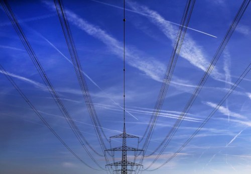 FILE - In this Nov. 1, 2017 file photo high power cables hang from a pole on a field in Hattersheim, Germany. A state-owned Dutch company that is the biggest electricity grid operator in Germany said Thursday, June 20, 2024 that talks on selling its German business to the government in Berlin have been terminated due to the administration's budget constraints. TenneT, one of four transmission network operators in Germany, announced plans for the talks in February 2023. (AP Photo/Michael Probst,file)