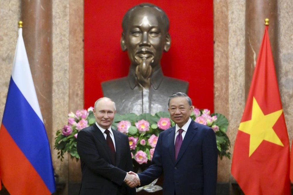 Russian President Vladimir Putin, left, and Vietnamese President To Lam pose for a photo prior to their talks at the Presidential Palace in Hanoi, Thursday, June 20, 2024. (Kristina Kormilitsyna, Sputnik, Kremlin Pool Photo via AP)