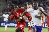 France's Marcus Thuram, right, duels for the ball with Canada's Alistair Johnston, centre, and Moise Bombito during the international friendly soccer match between France and Canada at the Matmut Atlantique stadium in Bordeaux, southwestern France, Sunday, June 9, 2024. Canada has moved up one place to No. 48 in the latest FIFA men's world rankings. THE CANADIAN PRESS/AP/Yohan Bonnet