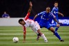 Toronto FC's Julian de Guzman slips as he goes for the ball ahead of Montreal Impact's Collen Warner during second half of Amway Canadian Championship, Wednesday, May 2, 2012 in Montreal. Toronto FC will find a familiar face rooting against them Saturday at Red Bull Arena. THE CANADIAN PRESS/Paul Chiasson
