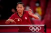 Canada's Mo Zhang competes during the table tennis women's singles second-round match against Yana Noskova at the 2020 Summer Olympics, Sunday, July 25, 2021, in Tokyo. Zhang and Eugene Wang will lead an experienced Canadian table tennis team at this summer's Paris Olympics. THE CANADIAN PRESS/AP Photo/Kin Cheung)