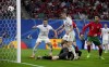 Portugal's Cristiano Ronaldo, right, watches Czech Republic's Robin Hranac second from right, score an own goal to make it 1-1 during a Group F match between Portugal and the Czech Republic at the Euro 2024 soccer tournament in Leipzig, Germany, Tuesday, June 18, 2024. (AP Photo/Sunday Alamba)