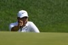 Tom Kim, of South Korea, lines up a shot on the 15th hole during the first round of the Travelers Championship golf tournament at TPC River Highlands, Thursday, June 20, 2024, in Cromwell, Conn. (AP Photo/Seth Wenig)