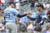 Tampa Bay Rays relief pitcher Pete Fairbanks, left, and catcher Alex Jackson celebrate their teams 7-6 win against the Minnesota Twins after a baseball game, Thursday, June 20, 2024, in Minneapolis. (AP Photo/Matt Krohn)