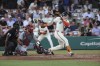 San Francisco Giants' Mike Yastrzemski follows through on a single during the third inning of a baseball game against the St. Louis Cardinals at Rickwood Field, Thursday, June 20, 2024, in Birmingham, Ala. (AP Photo/Vasha Hunt)