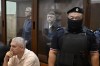 Former Russian Deputy Defense Minister Timur Ivanov, left, and Sergei Borodin stand in a defendants' cage prior to a court hearing on extension of their arrest in the Basmanny District Court in Moscow, Russia, Thursday, June 20, 2024. Timur Ivanov, who was in charge of military construction projects, was arrested on April 23 and charged with accepting bribes on a large scale. Sergei Borodin was also arrested and ordered into pre-trial detention on the same charges. (AP Photo/Dmitry Serebryakov)