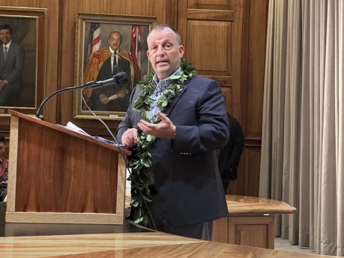 FILE - Hawaii Gov. Josh Green speaks at a news conference in Honolulu on Friday, Dec. 15, 2023. Hawaii's governor and lawyers for youth plaintiffs on Thursday, June 20, 2024, announced they settled a lawsuit alleging Hawaii violated the state constitution by operating a transportation system that harmed the climate and infringed upon the children's right to a clean and healthy environment..(AP Photo/Audrey McAvoy, File)