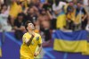 Ukraine's Mykola Shaparenko celebrates after scoring his side's opening goal during a Group E match between Slovakia and Ukraine at the Euro 2024 soccer tournament in Duesseldorf, Germany, Friday, June 21, 2024. (Fabio Ferrari/LaPresse via AP)