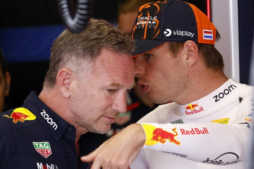 Red Bull Racing CEO, Christian Horner, speaks with Red Bull driver Max Verstappen of the Netherlands, during the 2nd practice session for the Formula 1 Spanish Grand Prix at the Barcelona Catalunya racetrack in Montmelo, near Barcelona, Spain, Friday, June 21, 2024. The race will be held on Sunday. (AP Photo/Joan Monfort)